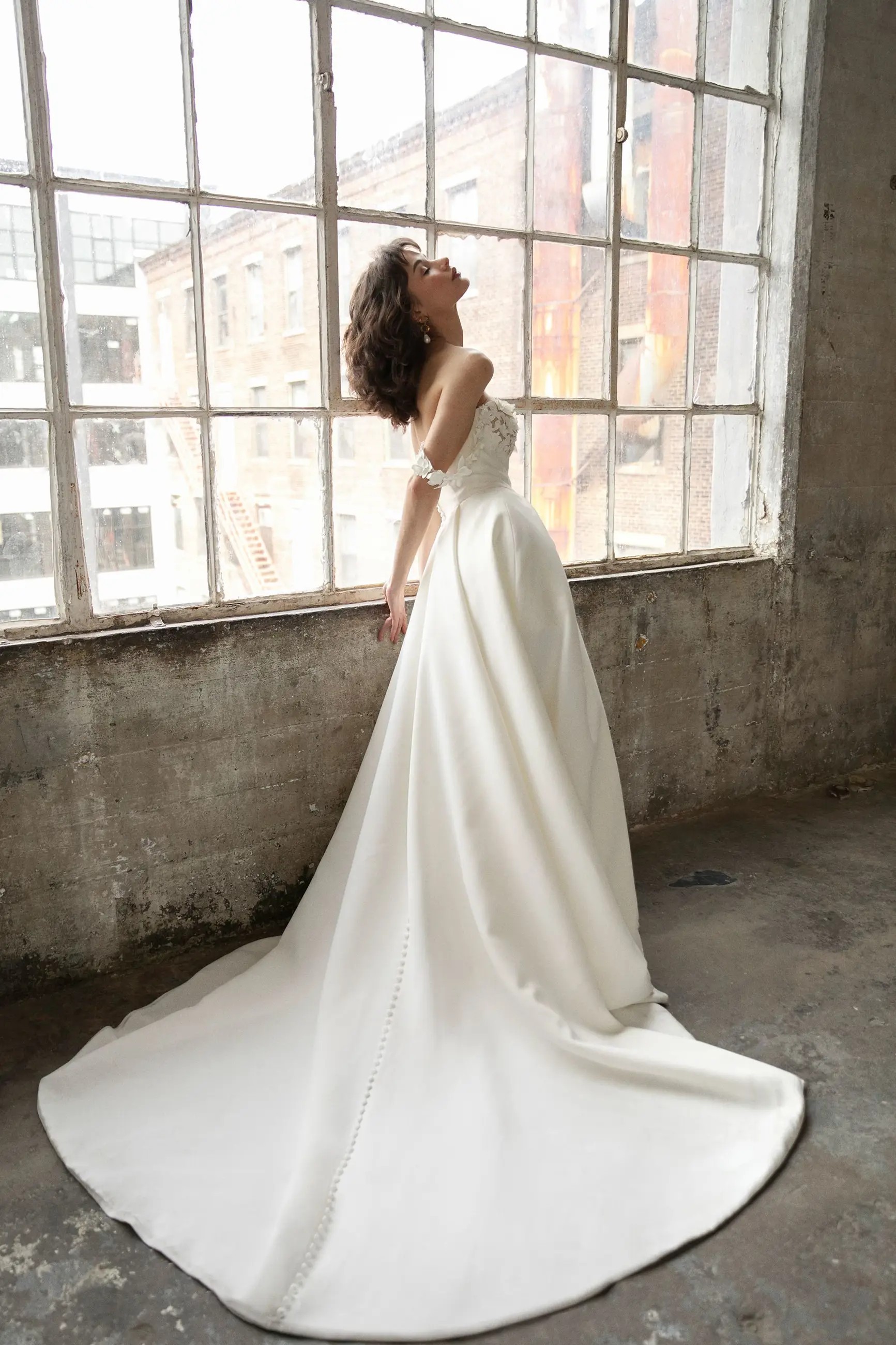 Model wearing Bobbie wedding dress by Justin Alexander Signature