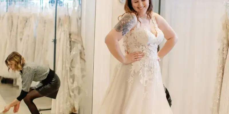 Bride Smiling in Lace A-Line Wedding Dress with Floral Appliqué