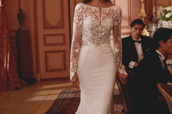 A fit and flare long sleeved wedding dress for fall weddings