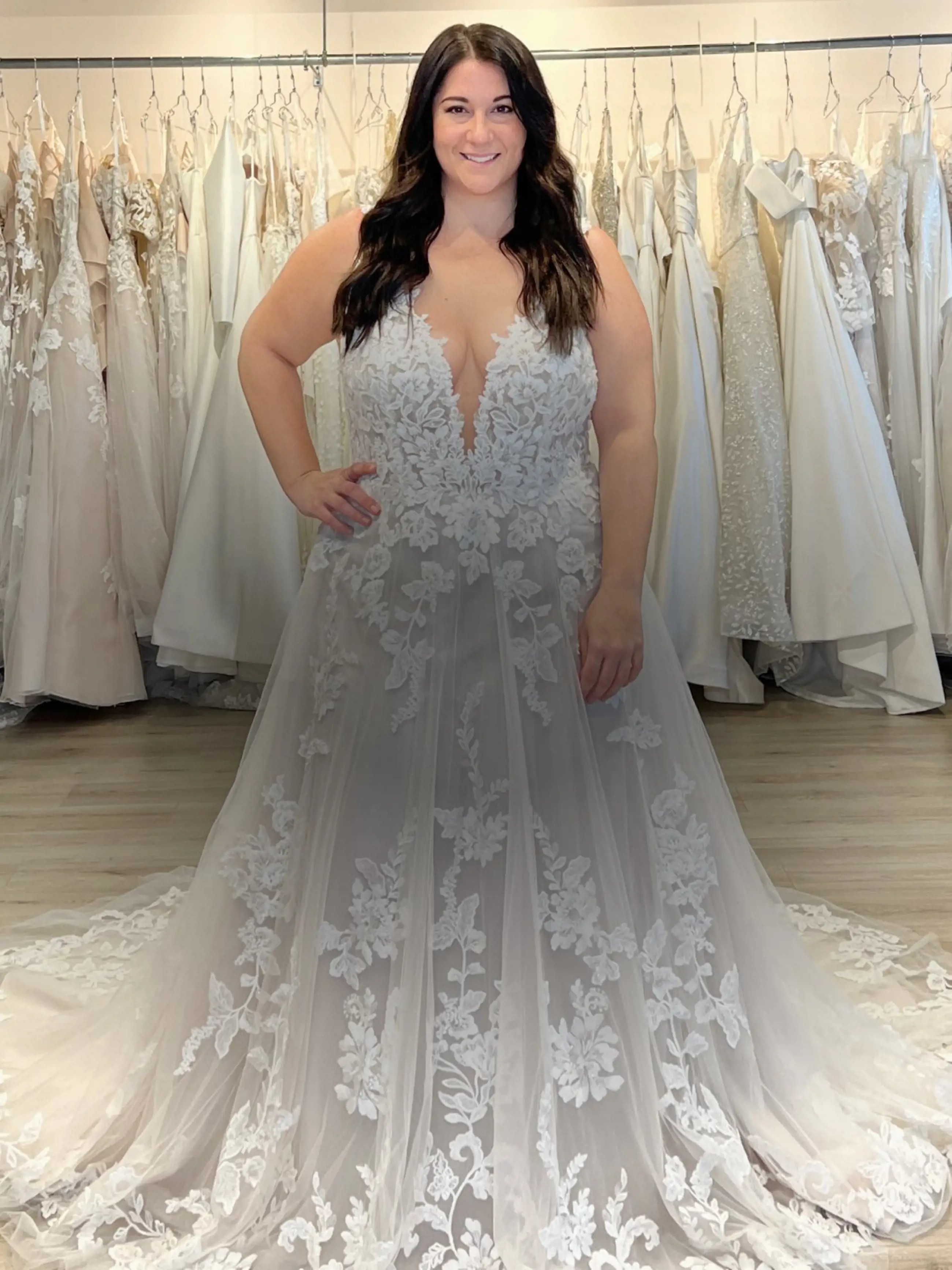 Model wearing a white gown. Mobile image