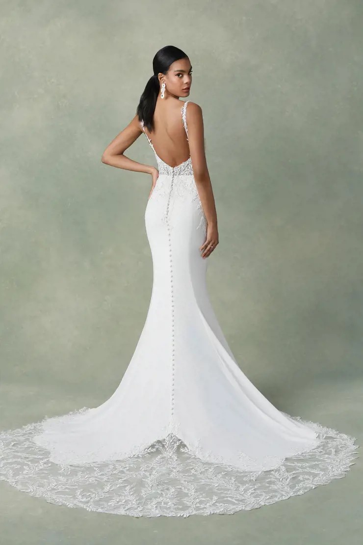 Model wearing a white gown