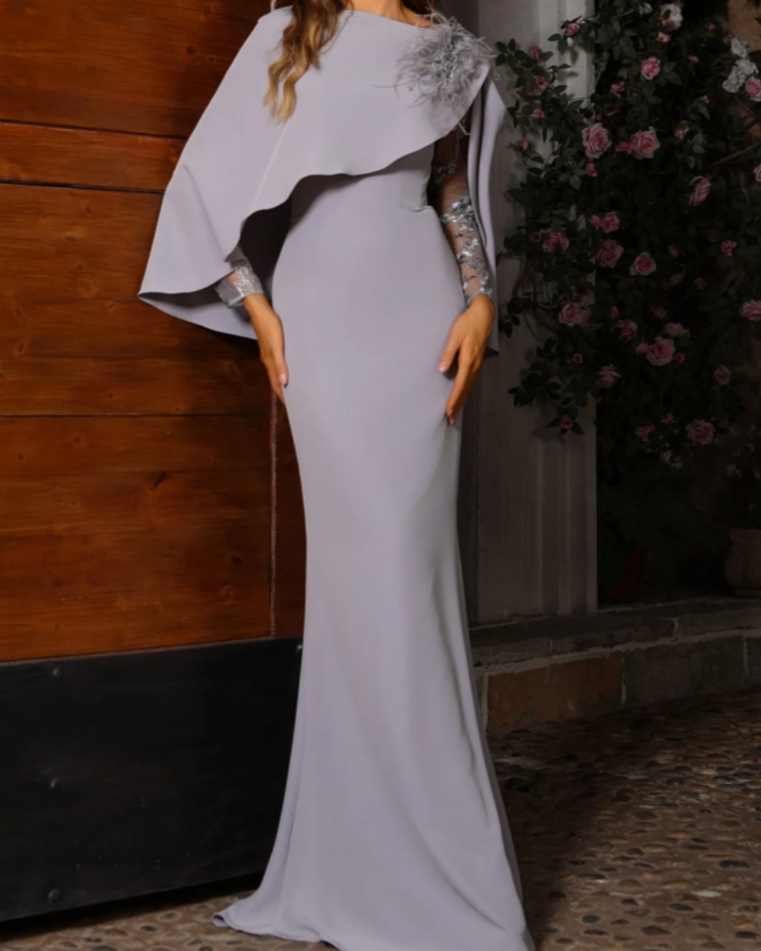 A mother of the bride in an elegant sheath dress