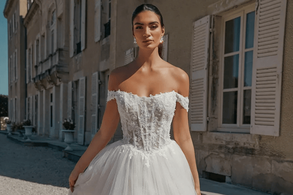 A bride-to-be in her off the shoulder wedding dress