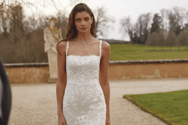 A bride in her beautiful wedding dress with a square neckline