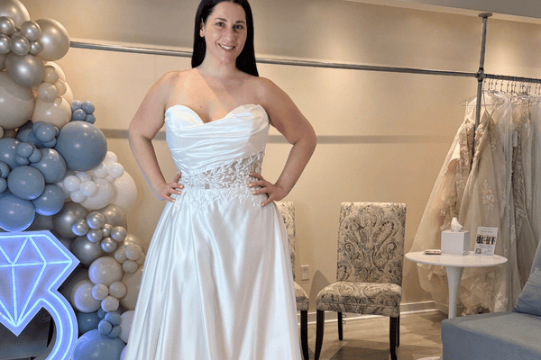 A bride in her wedding gown smiling 