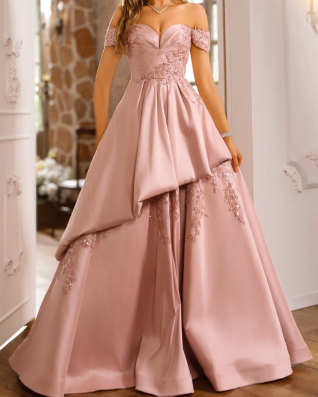 A mother of the groom in s sophisticated ballgown