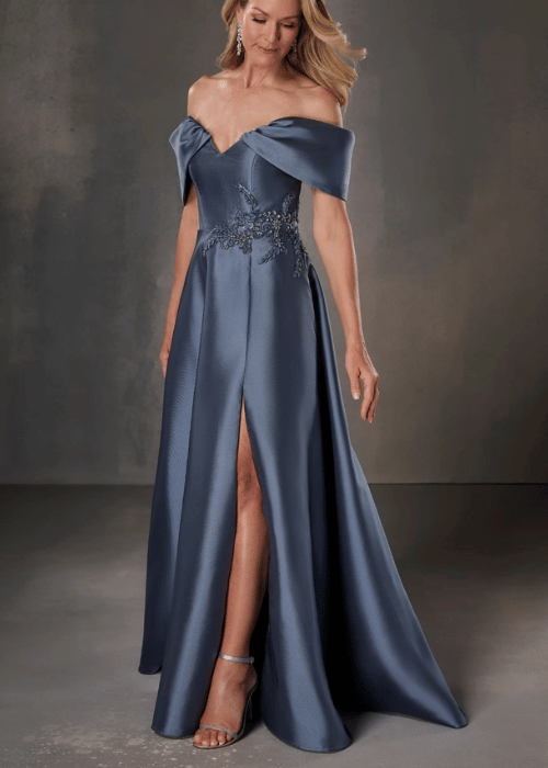 Dusty blue off-the-shoulder mother of the bride gown with satin fabric, embroidered waist detailing, and a front slit.