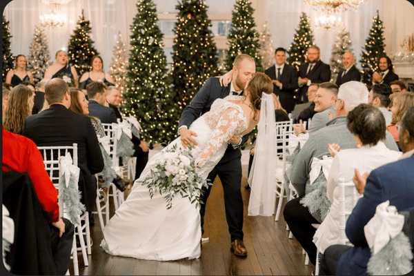A groom and bride wearing her winter wedding dress