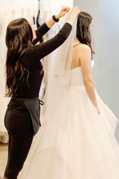 bride trying on a veil
