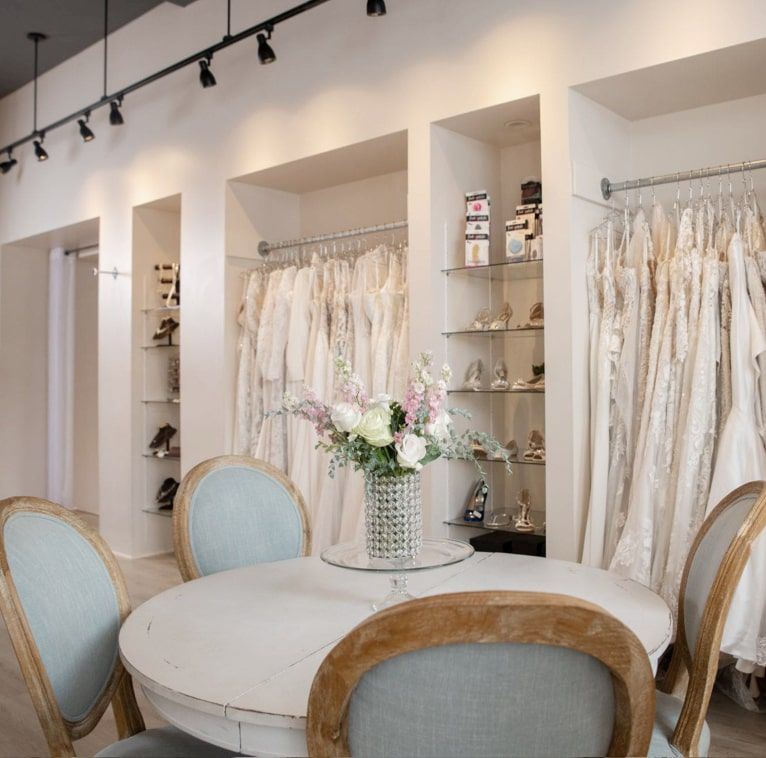 Bridal store image with dresses and flowers